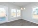 Open dining area with natural light, wood-look floors, and outdoor access at 132 Ambergate Ct, Rocky Mount, NC 27804