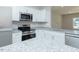Modern kitchen with granite countertops, stainless steel appliances and white cabinetry at 132 Ambergate Ct, Rocky Mount, NC 27804