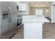 Modern kitchen with stainless steel appliances, granite counters, and wood-look flooring at 132 Ambergate Ct, Rocky Mount, NC 27804