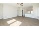 Spacious living room with an open layout, hardwood floors, and a view of the modern kitchen at 132 Ambergate Ct, Rocky Mount, NC 27804