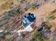 Aerial view showcases a wooded lot and circle driveway at 148 Evington Dr, Pittsboro, NC 27312