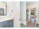 Stylish bathroom featuring modern fixtures, glass shower, and elegant gray and white color scheme at 148 Evington Dr, Pittsboro, NC 27312