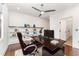 Modern home office with a sleek wooden desk, built-in shelves, and comfortable seating for productivity at 148 Evington Dr, Pittsboro, NC 27312