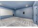 Home theater room with projector screen, speakers, and dimmable lighting for immersive experience at 148 Evington Dr, Pittsboro, NC 27312
