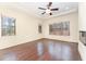 Spacious main bedroom with large windows, hardwood floors, and a ceiling fan at 148 Evington Dr, Pittsboro, NC 27312