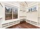 Walk-in closet with built-in shelving, hanging rods, and a scenic window view at 148 Evington Dr, Pittsboro, NC 27312