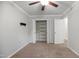 Bedroom with neutral carpeting, a ceiling fan, a closet, and white trim, offering a serene space at 1512 Maybrook Dr, Raleigh, NC 27610