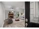 Inviting living room features a cozy fireplace, modern furniture, and a soothing color palette at 1512 Maybrook Dr, Raleigh, NC 27610
