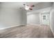 Spacious living room with wood-look flooring, neutral paint, and a ceiling fan at 1512 Maybrook Dr, Raleigh, NC 27610