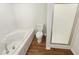 Relaxing bathroom with a soaking tub, separate shower, and neutral finishes at 1515 Indian Camp Rd, Chapel Hill, NC 27516