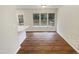 Bright dining area with hardwood floors, large windows, and a view of the backyard at 1515 Indian Camp Rd, Chapel Hill, NC 27516