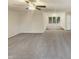 Spacious living room with gray carpet and neutral walls flows into sunroom at 1515 Indian Camp Rd, Chapel Hill, NC 27516