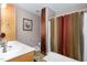 Bathroom with a single sink vanity, with a framed print on the wall at 161 Kerr Lake Club Dr, Henderson, NC 27537