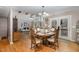 Open dining room with access to the living room and an outdoor deck at 161 Kerr Lake Club Dr, Henderson, NC 27537