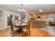 Elegant dining room with french doors and view into spacious kitchen at 161 Kerr Lake Club Dr, Henderson, NC 27537