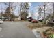 Wide driveway featuring ample parking space for multiple vehicles and RV with storage at 161 Kerr Lake Club Dr, Henderson, NC 27537