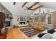 Bright living room with large windows, fireplace and vaulted ceilings at 161 Kerr Lake Club Dr, Henderson, NC 27537
