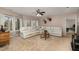 Comfortable living room featuring plush carpeting, a sectional sofa, and natural light from the many double-paned windows at 161 Kerr Lake Club Dr, Henderson, NC 27537