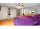 Bright main bedroom with hardwood floors, closet, and ensuite bathroom access at 161 Kerr Lake Club Dr, Henderson, NC 27537