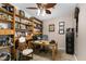 Functional office space with custom wood shelving, comfortable chair, and soft carpet at 161 Kerr Lake Club Dr, Henderson, NC 27537