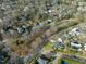 Residential aerial view showcasing homes in a tree-filled neighborhood at 201 W Park Dr, Raleigh, NC 27605