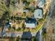 A private home with a garden, patio, mature trees, and lush landscaping for outdoor relaxation and enjoyment at 201 W Park Dr, Raleigh, NC 27605