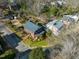 Aerial view of the home and neighborhood with mature trees and quiet streets at 201 W Park Dr, Raleigh, NC 27605