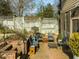 A charming brick patio and landscaped yard create a welcoming outdoor space in the backyard at 201 W Park Dr, Raleigh, NC 27605
