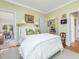 Bright bedroom features light green walls, hardwood floors, and stylish decor at 201 W Park Dr, Raleigh, NC 27605