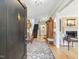 Grand entryway with hardwood floors, staircase, rug, and access to the living room at 201 W Park Dr, Raleigh, NC 27605