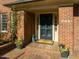 Close-up of front door and porch showing brickwork and number 201 at 201 W Park Dr, Raleigh, NC 27605