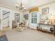 Cozy living room featuring a plush chaise lounge, neutral decor, and a classic chandelier at 201 W Park Dr, Raleigh, NC 27605