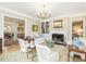 Comfortable living room with a fireplace, built-in bookcase, and lots of natural light at 201 W Park Dr, Raleigh, NC 27605