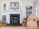 Cozy reading nook with fireplace, built-in bookcase, and comfortable seating at 201 W Park Dr, Raleigh, NC 27605