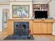 A living room with a fireplace, built-in shelving, and large painting create a comfortable space at 201 W Park Dr, Raleigh, NC 27605