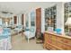 Charming sunroom with brick accents, comfortable seating, and natural light creating a relaxing space at 201 W Park Dr, Raleigh, NC 27605