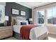 Stylized bedroom with a large bed, elegant bedside tables and lamps, with natural light from the surrounding windows at 2013 Trident Maple Ln, Chapel Hill, NC 27517