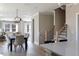 Spacious dining area featuring a modern chandelier and views into the living room and staircase at 2013 Trident Maple Ln, Chapel Hill, NC 27517