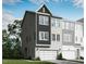 New two-story townhome with an attached two-car garage, modern architectural details, and neutral color palette at 2013 Trident Maple Ln, Chapel Hill, NC 27517