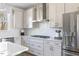 Well-lit kitchen featuring modern stainless steel appliances and white countertops with subway tile backsplash at 2013 Trident Maple Ln, Chapel Hill, NC 27517