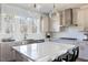 Well-lit kitchen featuring modern stainless steel appliances, a kitchen island and white countertops at 2013 Trident Maple Ln, Chapel Hill, NC 27517