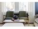 Modern living room design with comfortable seating, decorative accents, and natural light from large windows at 2013 Trident Maple Ln, Chapel Hill, NC 27517