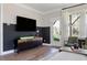 Modern living room featuring a large tv and modern cabinet at 2013 Trident Maple Ln, Chapel Hill, NC 27517