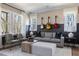 Well-lit living room featuring comfortable seating, natural light, and guitars displayed on the wall at 2013 Trident Maple Ln, Chapel Hill, NC 27517