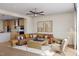 Cozy living room with comfortable sectional, ceiling fan and ample natural light at 2021 Trident Maple Ln, Chapel Hill, NC 27517