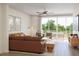 Spacious living room with a sliding glass door to the outside and a comfortable sofa at 2021 Trident Maple Ln, Chapel Hill, NC 27517