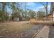 View of the backyard that features a deck with stairs and some landscaping at 2607 Nation Ave, Durham, NC 27707