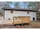 White painted brick on back of home with access to the backyard deck and patio at 2607 Nation Ave, Durham, NC 27707