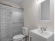 Bathroom featuring stylish white tiles, a modern toilet, and a sleek vanity at 2607 Nation Ave, Durham, NC 27707