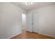 Bedroom with hardwood floors and a double door closet for ample storage space at 2607 Nation Ave, Durham, NC 27707
